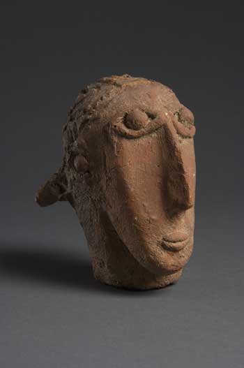 This ceramic head is from the Beta Israel (literally,
 “House of Israel”) culture of Ethiopia, comprised of Jews of Ethiopian 
descent that have had a presence in Ethiopia since the 14th century. 
Though primarily agricultural, they are also known for their exquisite 
crafts and jewelry as well as blacksmithing and pottery-making. Photo by
 Thomas R. DuBrock