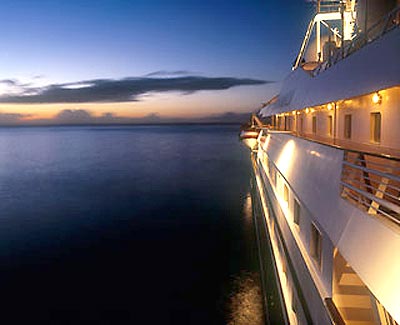 A yachtside view of the deep blue sea, just after 
sunset
